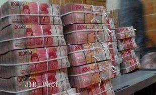   Rupiah Melemah ke Level Rp9,595