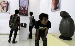 PAMERAN PATUNG