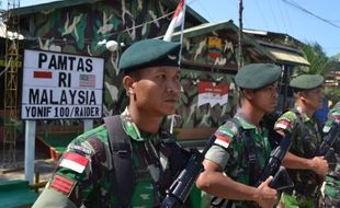 FOTO PERBATASAN RI : Yonif 100/Raider Jaga Batas Negeri Sabah