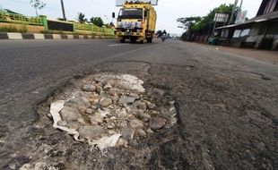 FOTO MUDIK LEBARAN 2014 : Jalur Jalan Pantura Masih Berlubang