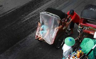 FOTO TRANSPORTASI TRADISIONAL : Becak Kayuh tetap Jadi Ikon