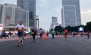 Ribuan Pelari Berkompetisi di LPS Monas Half Marathon Jakarta